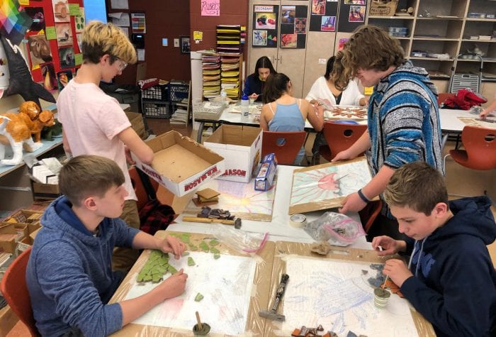 Students creating their mosaics.