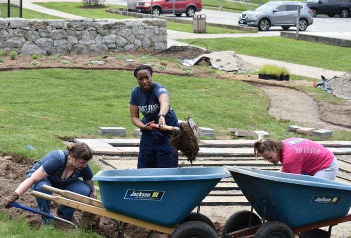 Cynthia, Kameko, and Dayna digging out the pathway
